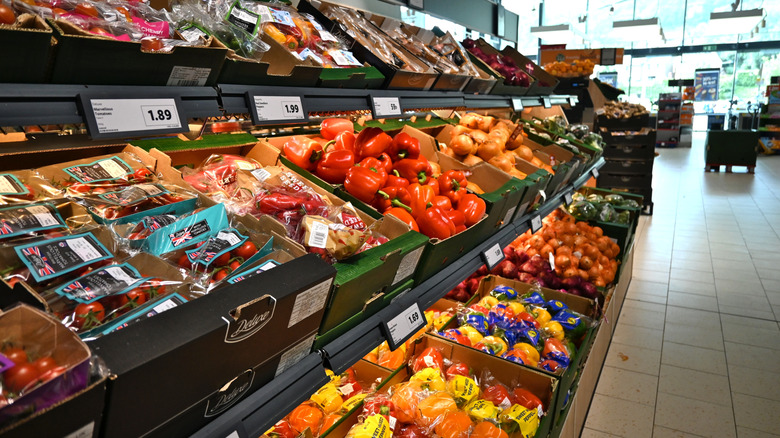 Fresh vegetables and fruit in the produce aisle of an Aldi store