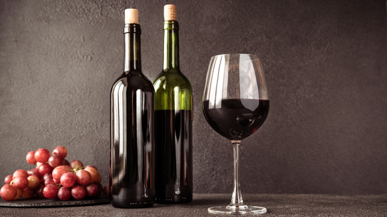 Grapes, wine bottles, and wine glass